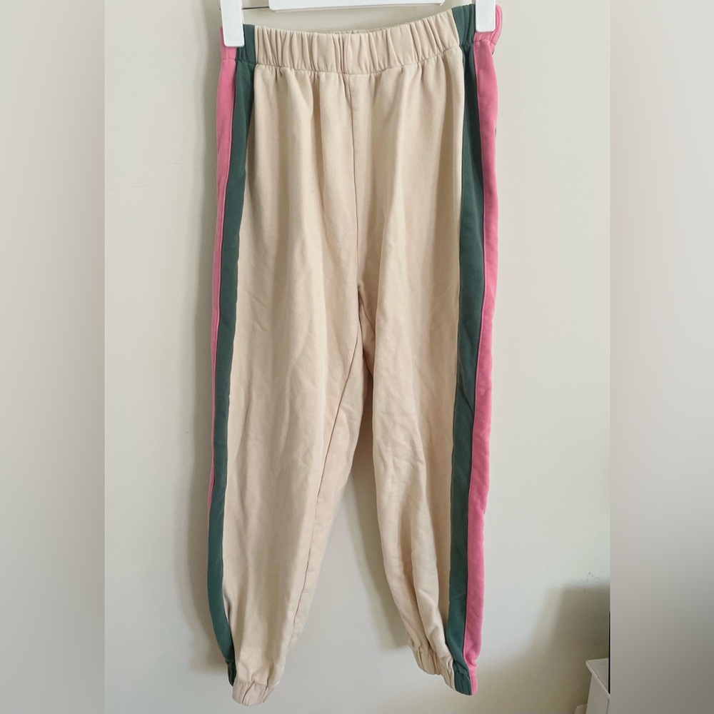 green and pink striped sweats